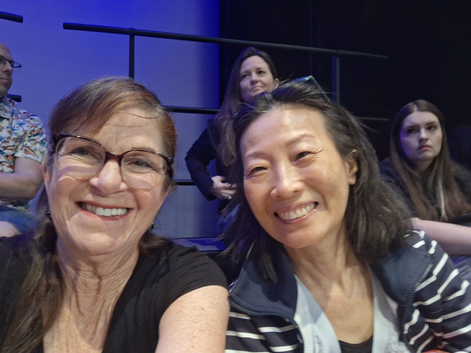 Two singers taking a selfie together before a performance